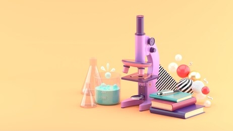 microscopes, books and test tubes amidst colorful balls on an orange background.-3d rendering.
