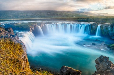 godafoss is a very beautiful icelandic waterfall. it is located on the north of the island not far from the lake myvatn and the ring road. this photo is taken after the midnight sunset
