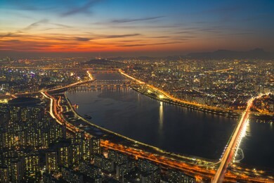 sunset scene of bridge cross over han river from yeouido business district into n seoul tower at seoul city in south korea
