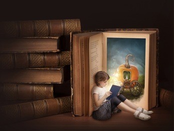 girl reading fairy story book