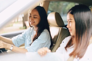 two young asian driving car for travel on vacation time.