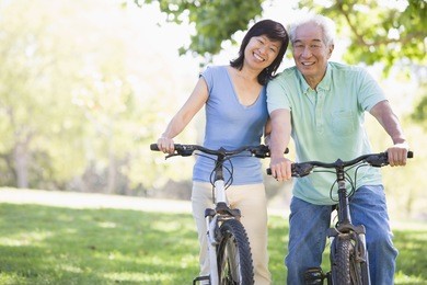 mature couple bike riding.
