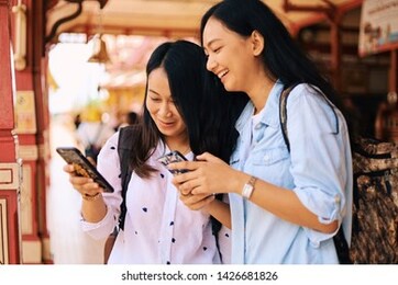 two young asian woman traveling together in long vacation.