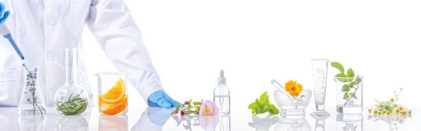 scientific experiment.herbs,flower and orange  in test tubes