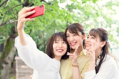group of asian woman taking a selfie.