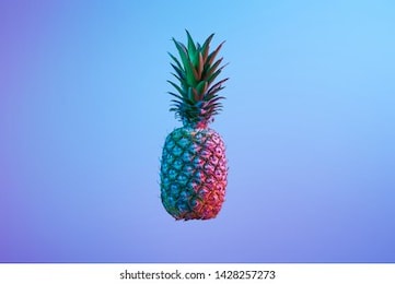 fancy pineapple in neon colors and lights flying in the air on blue background