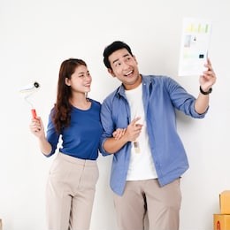 asian couple choosing colour palette for their new house, lifestyle concept.