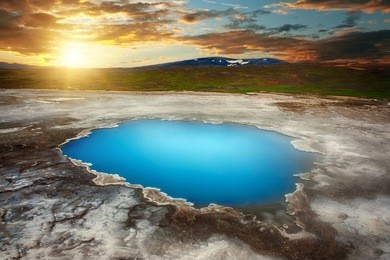 incredibly blue pool blahver at hveravellir is actually a hot geothermal spring in the heart of iceland. photo taken around midnight sunset