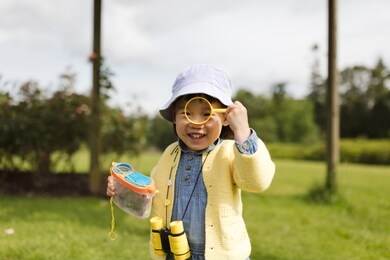toddler girl playing exploration in spring park