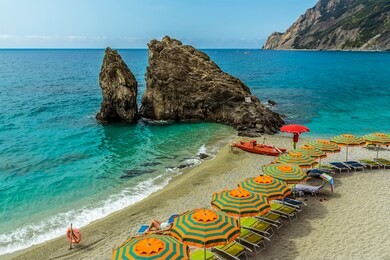 a view over a secluded beach at monterosso al mare, italy in summer