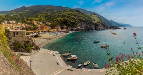 a view over the beach and cliffs at monterosso al mare, italy in summer
