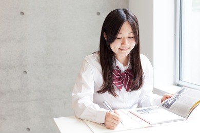 cute school girl studying in class room