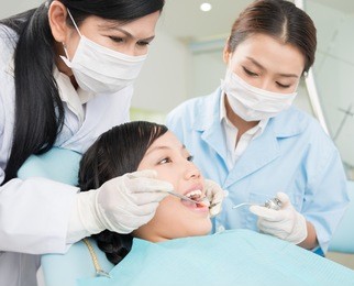image of a teenager having dental procedure in the clinic
