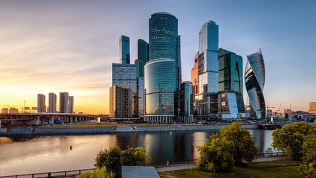moscow-city skyscrapers at sunset, russia. moscow-city is a business district on embankment of moskva river. modern tall buildings of moscow at dusk. urban landscape of moscow in summer evening.