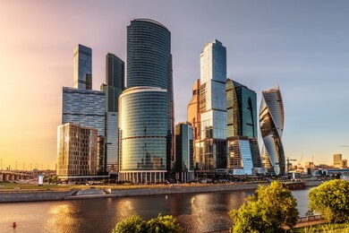 moscow-city skyscrapers at sunset, russia. moscow-city is a business district on embankment of moskva river. urban landscape of moscow in summer evening. panorama of modern buildings in moscow center.