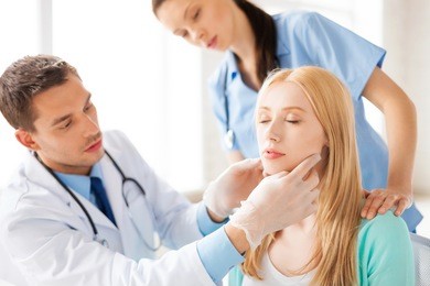 bright picture of male plastic surgeon with patient