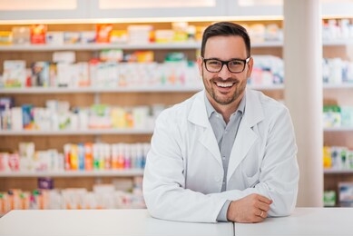smiling portrait of a handsome pharmacist.