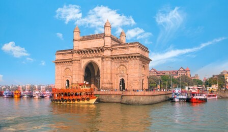 the gateway of india and boats as seen from the harbour - mumbai, india