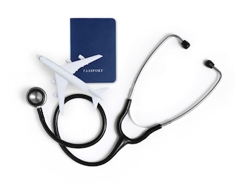 international medical travel insurance concept, stethoscope, passport and airplane isolated on white background