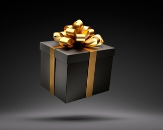 black closed gift box with golden ribbon isolated on black background - 3d illustration
