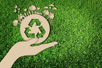 paper art style of eco on green grass background.  save the earth.