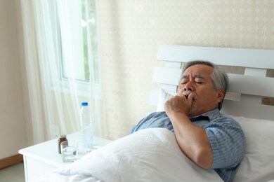 elderly patients in bed, asian senior man patients sore throat hands on neck - medical and healthcare concept