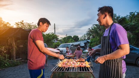 bbq party group of people at barbecue dinner friends having food together outdoor as summer with friendship asian person.