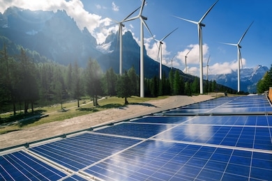 solar energy panel photovoltaic cell and wind turbine farm power generator in nature landscape for production of renewable green energy is friendly industry. clean sustainable development concept.