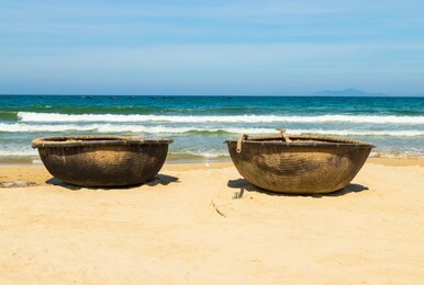 basket boats on my khe beach in danang. traditional vietnamese small fishing boats on my khe beach in danang, vietnam.