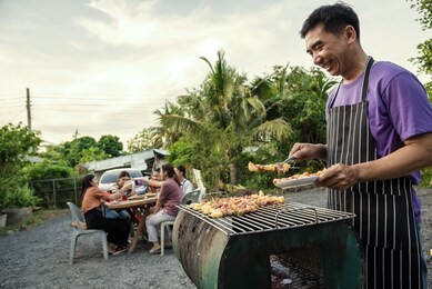 bbq party group of people at barbecue dinner friends having food together outdoor as summer with friendship asian person.