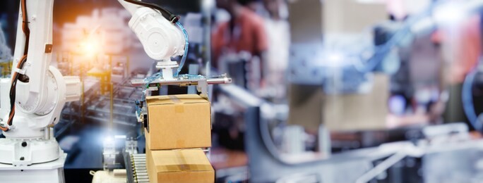 industrial robot arm control holding package box. banner background for operating of robot machine in the warehouse logistics, robots manage manufacturing and logistics.