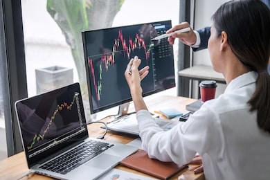 business team investment working with computer, planning and analyzing graph stock market trading with stock chart data, business financial investment and technology concept.