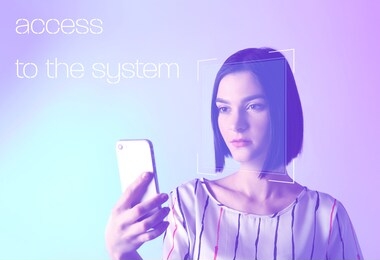 young woman with mobile phone using facial recognition system for data protection