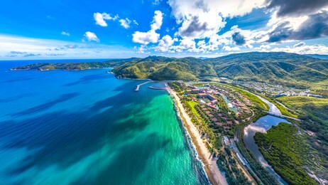 coastal scenery of luxury resort with villas, yacht marina and recreational beach at yalong bay, sanya, hainan island, china. aerial view. 