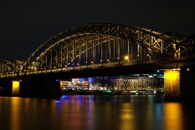 cologne cathedral and hohenzollern bridge at night in cologne, germany