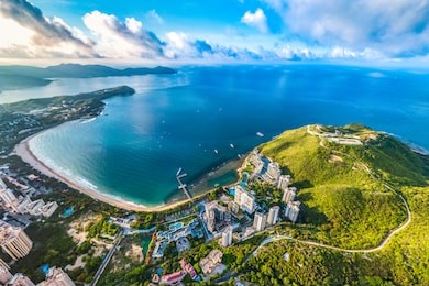 dadonghai recreational beach at sanya, hainan province, china, asia. aerial view of coastal landscape with hotels, resorts and apartment buildings at the tropical island.