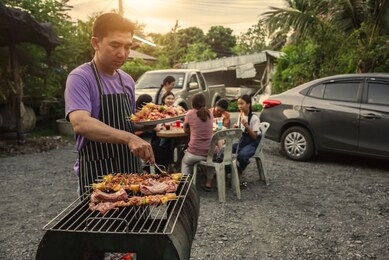 bbq party group of people at barbecue dinner friends having food together outdoor as summer with friendship asian person.