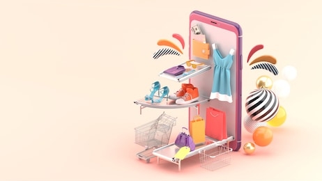 the fashion house on the smartphone is surrounded by colorful balls on a pink background.-3d rendering.