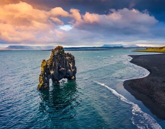 view from flying drone. beautifulsunset with huge basalt stack - hvitserkur on background. splendid summer scene of eastern shore of the vatnsnes peninsula, iceland, europe.
