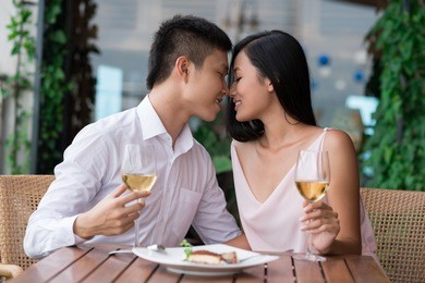 image of amorous young people on a date being about to kiss
