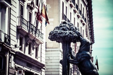 symbol of madrid - statue of bear and strawberry tree, puerta del sol, spain
