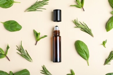 flat lay composition with herbal essential oil on beige background