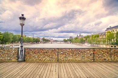 love padlocks on pont des arts bridge, seine river in paris. france, europe.