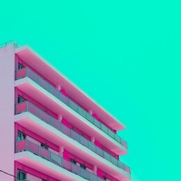 pink hotel and green sky in infrared style. tropical travel concept. minimalism