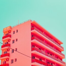 orange hotel and blue sky in tropical travel concept. minimalism