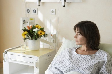 female patient resting in hospital bed