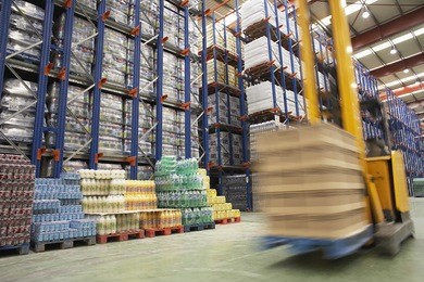 view of speeding forklift in warehouse
