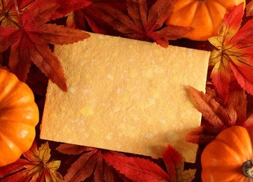 autumn or thanksgiving greeting card with copy space. (artificial leaves) 