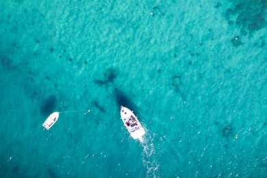 aerial view of boats in the ocean. boats at the seaside. aerial view of ski jet in the ocean.