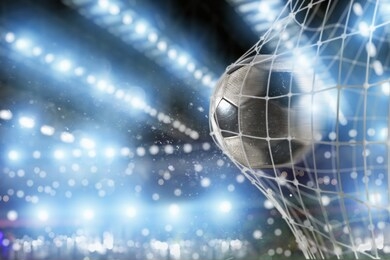 soccer ball scores a goal on the net